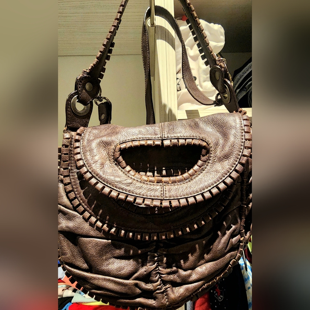 100% Leather Lockheart shoulder bag. Brown leather. Approx size  11 " x 11"